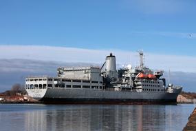 a big ship on a blue sky background