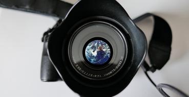 camera lens with a planet