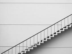 Scenery of grey stairs on Building wall