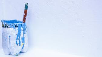white bucket with blue paint