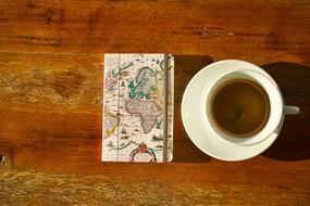 sweet coffee with a book on the table