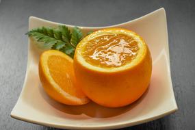 ripe juicy orange in a bowl