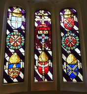 coats of arms on Stained Glass window of Hampton Court palace, uk, england