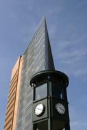 historic clock tower by the houses