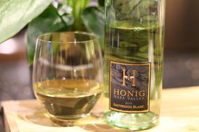 white wine in a glass and bottle