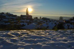 snowy landscape on the background of the sun