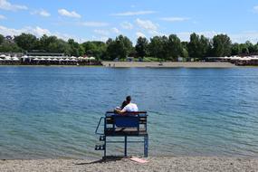 people sitting by the water