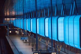 photo of blue luminous platforms in the factory