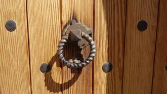 wooden door of a village house close up