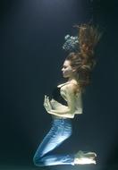 photo of a girl under water