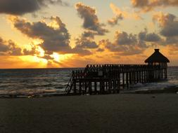 beach construction at sunset