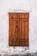 Window closed with old Wooden shutters, cyprus, avgorou