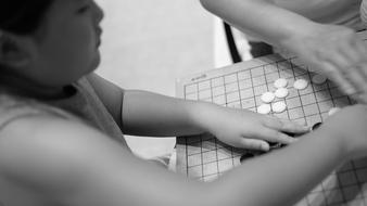 girl plays a game on the board