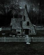 Black and white photo of the old cottage among the fence and trees