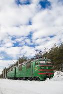 white cloud and green train