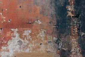 Texture of old grunge Wall with peeling Red paint