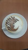 frothy hot coffee with a pattern