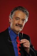 photo of a professor on a burgundy background