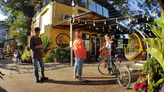 people relaxing near the cafe