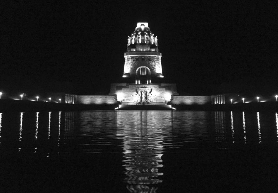 Black and white of the beautiful VÃ¶lkerschlachtdenkmal with lights at night, in Leipzig, Germany