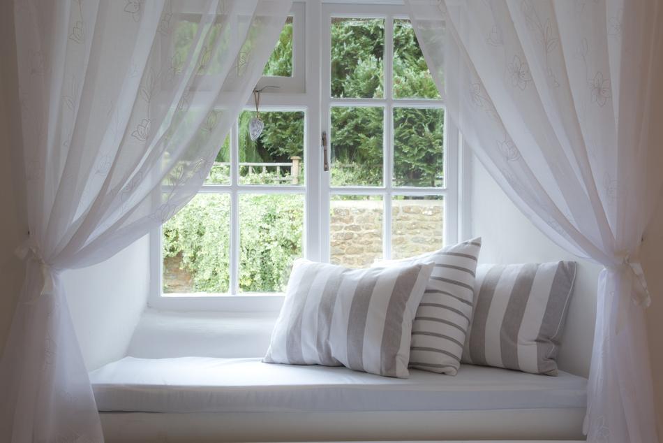 white pillows by the window