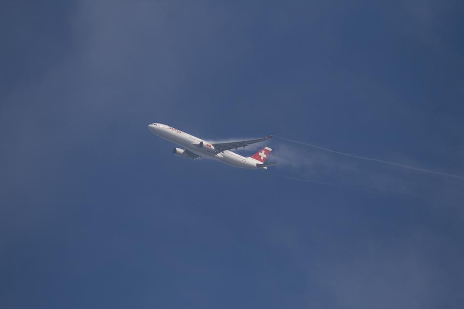 a flying plane in a beautiful sky