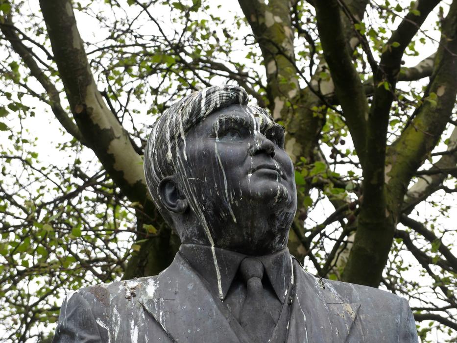 soiled statue of a man