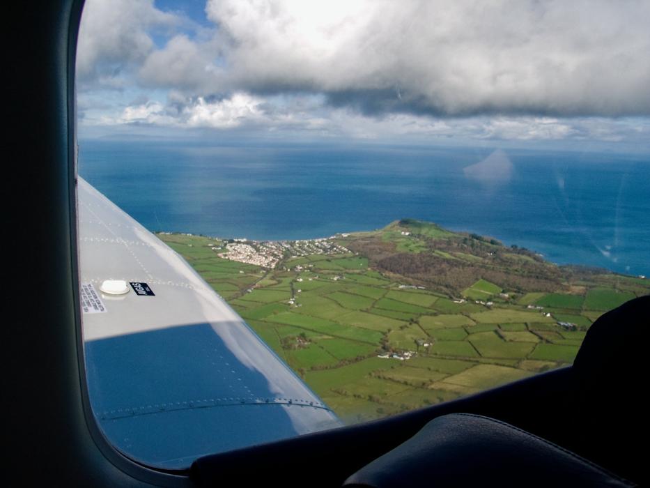 Light Aircraft Flying Coastline