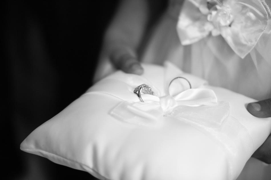 a bow on a pillow in his hands