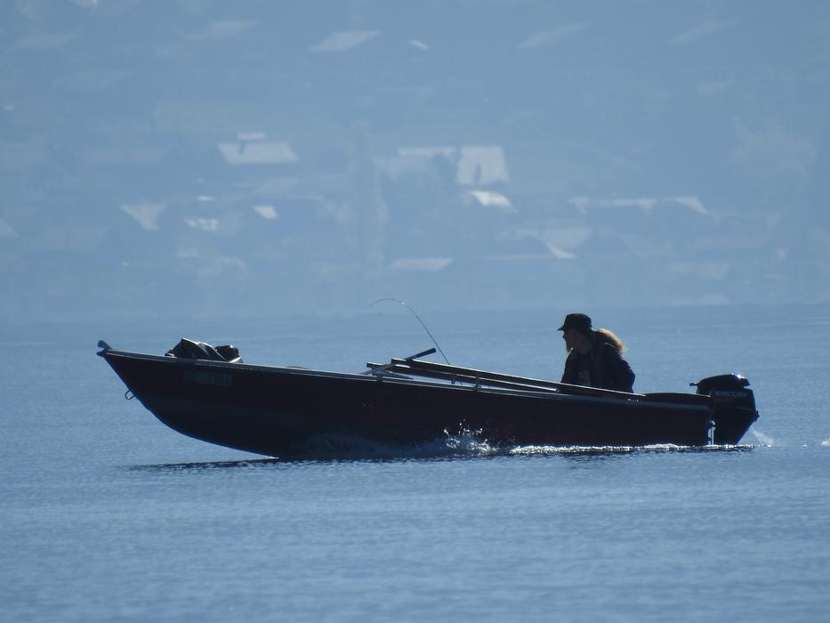 a man on a boat in the ocean