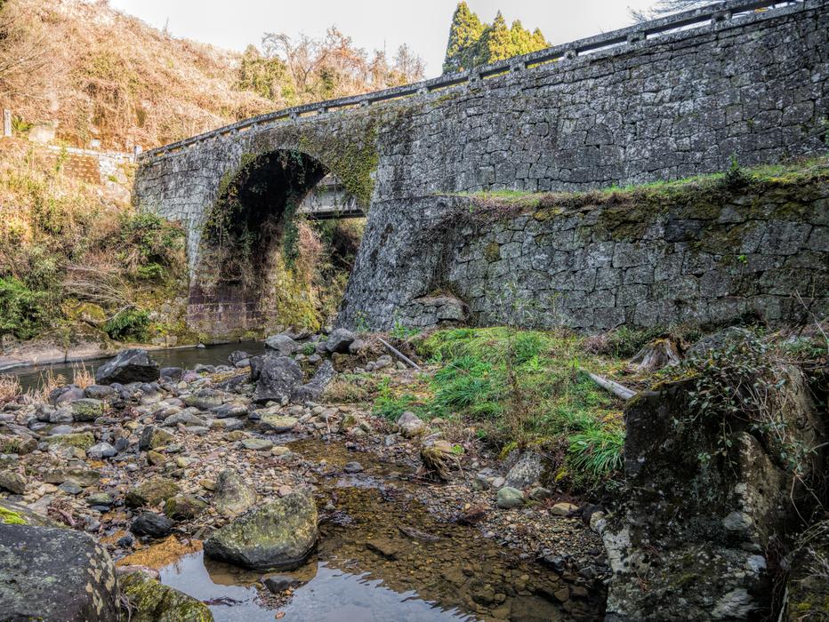 Side view of the stone bridge by the river