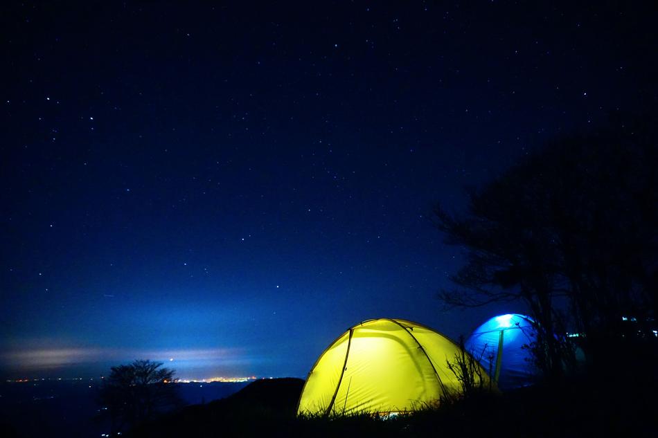tents in the night under a starry sky