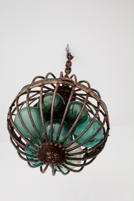 green glass spheres in a hanging lamp