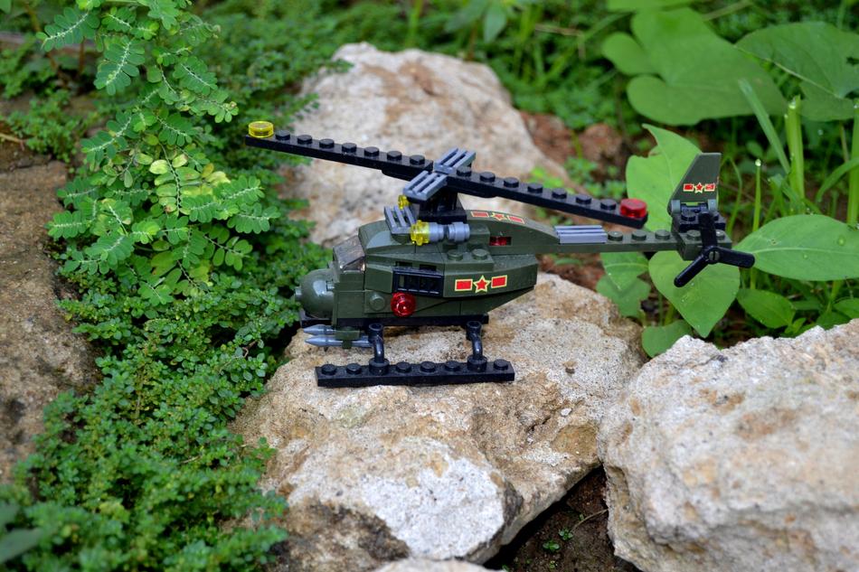 lego helicopter on a rock