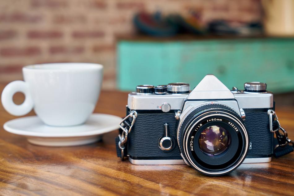 a camera with a coffee mug