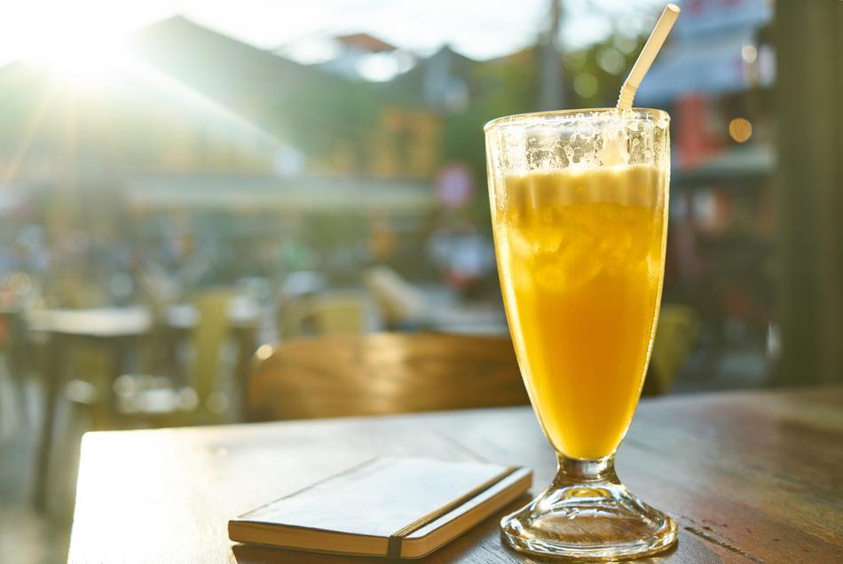 Beautiful orange juice in the glass in light
