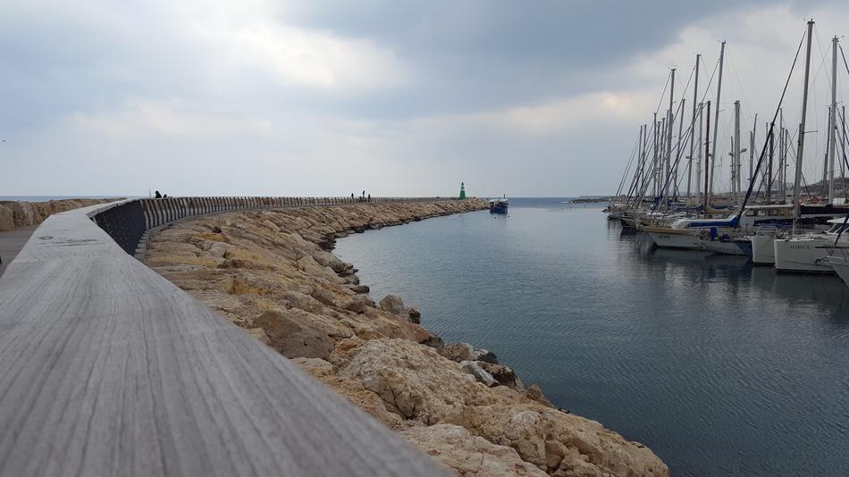 lake with ships on the beach