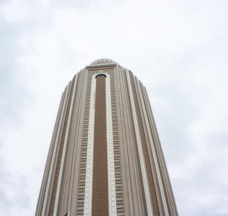 a large tower on a background of clouds