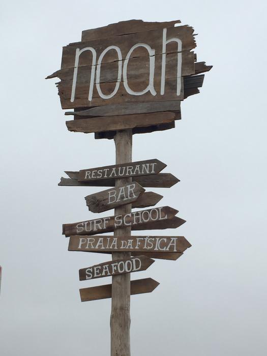 wooden sign against a foggy background