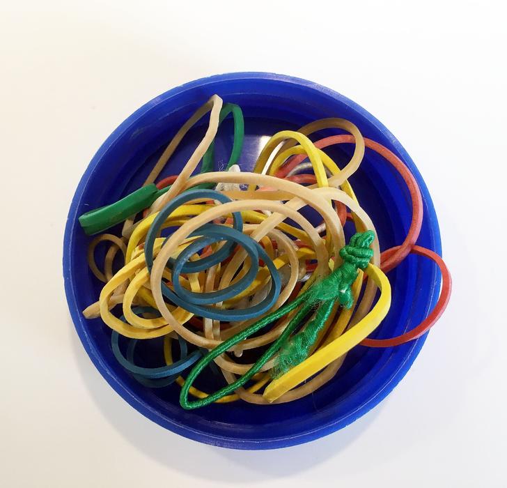 colored rubber bands in a pot
