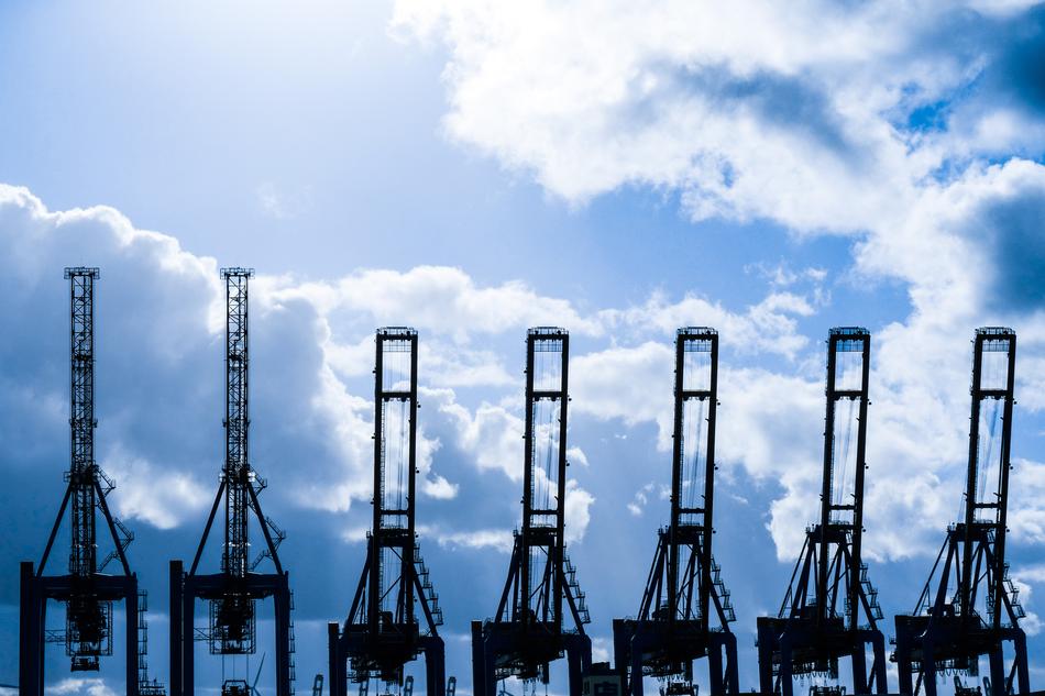 crane ships in port at sea