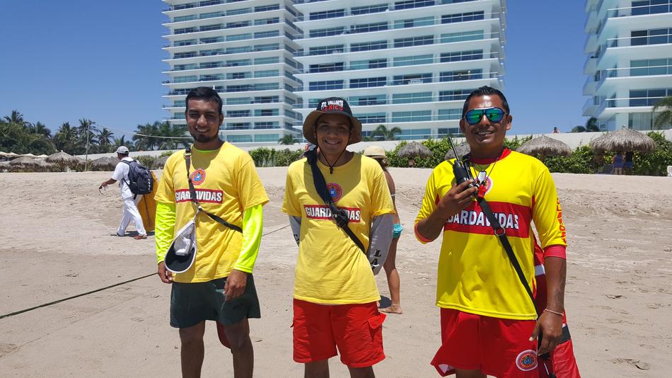 three men on a beach
