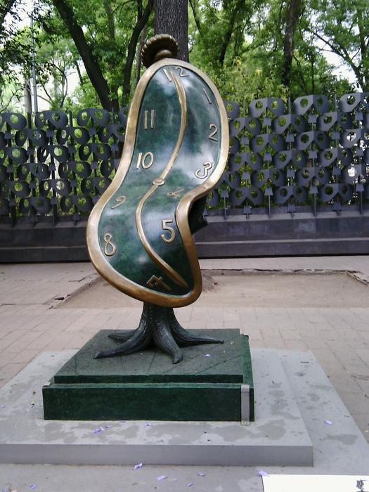 Close-up of the colorful and beautiful, shiny sculpture, near the green trees in Paseo De La Reforma, Mexico