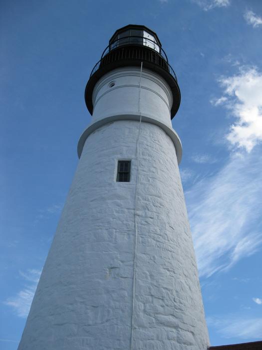 tall white lighthouse against the sky