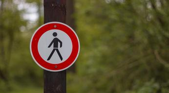 warning sign on the pole