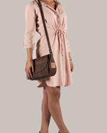 Model of a girl in a dress with a bag