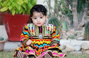 Baby Girl in colorful traditional clothing, Pakistan