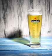 refreshing beer in a glass on the table