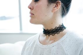 black choker around the girl's neck