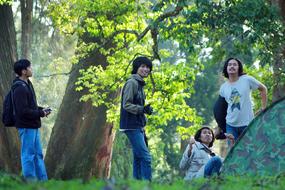 Friends group with Tent in frest